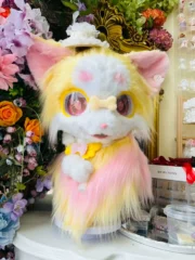 A soft pastel kemono fursuit head inspired by warm honey tones and spring florals, featuring gentle color gradients and a sweet, plush character expression.